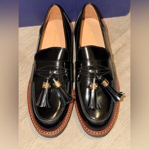 Stuart Weitzman Glossy Black Tassel Loafers